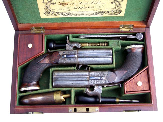A fine Cased Pair of Over and Under Boxlock Percussion Pistols by John Blisset, London, c. 1840